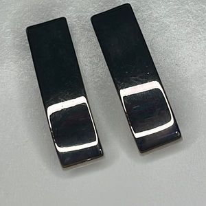 Express silver tone bar clip on earrings.